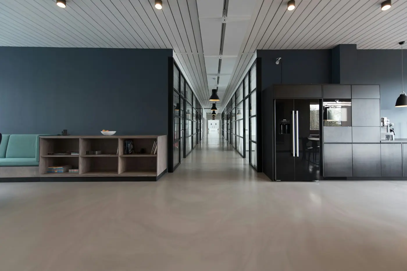Modern minimalist office corridor with dark interior finishes